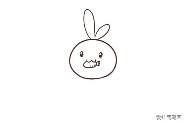 第四步:然后画个胡萝卜，在兔子的嘴里叼着。